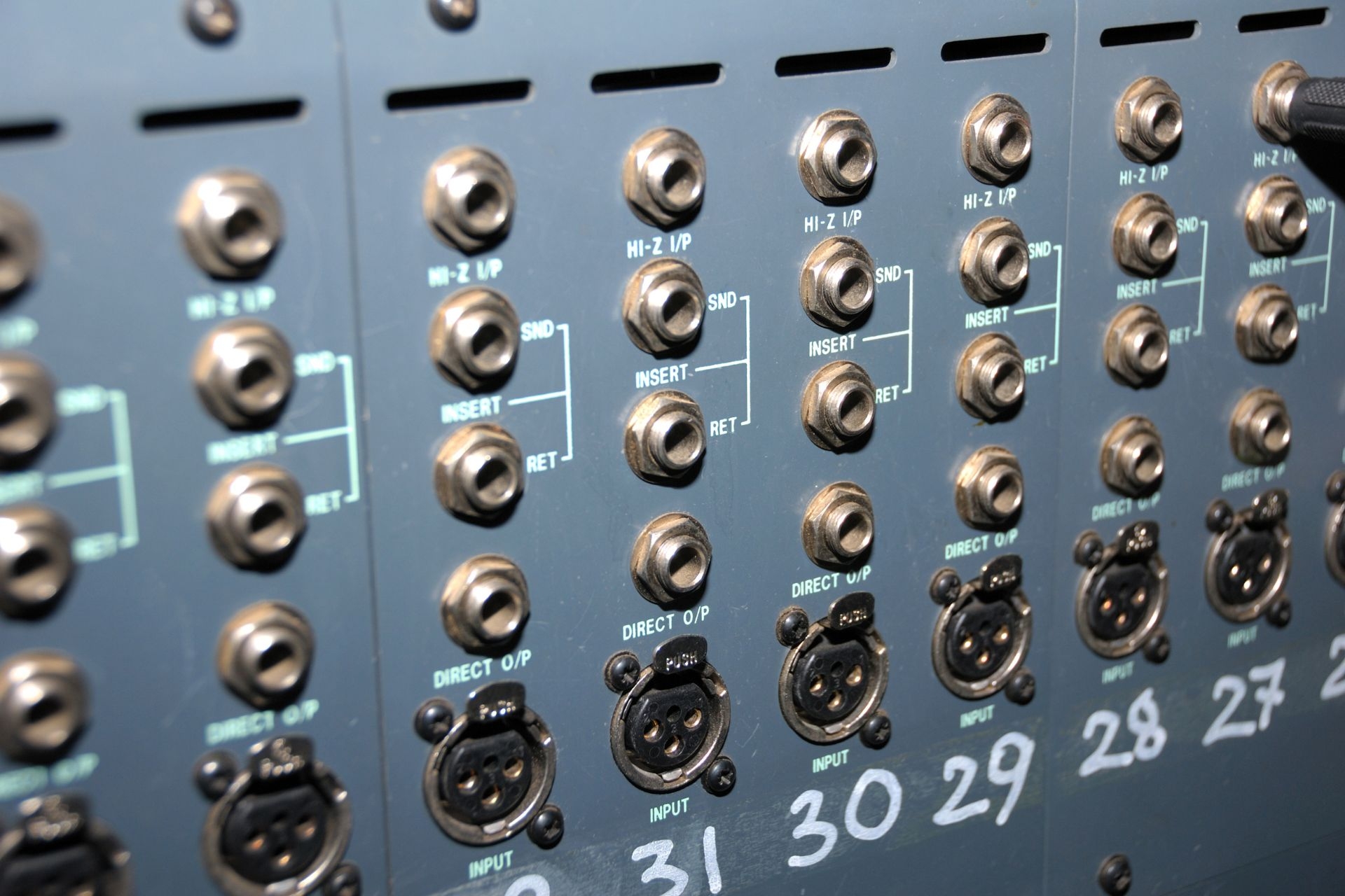 How can audio distribution amplifiers help in maintaining signal integrity and preventing signal degradation over long cable runs?