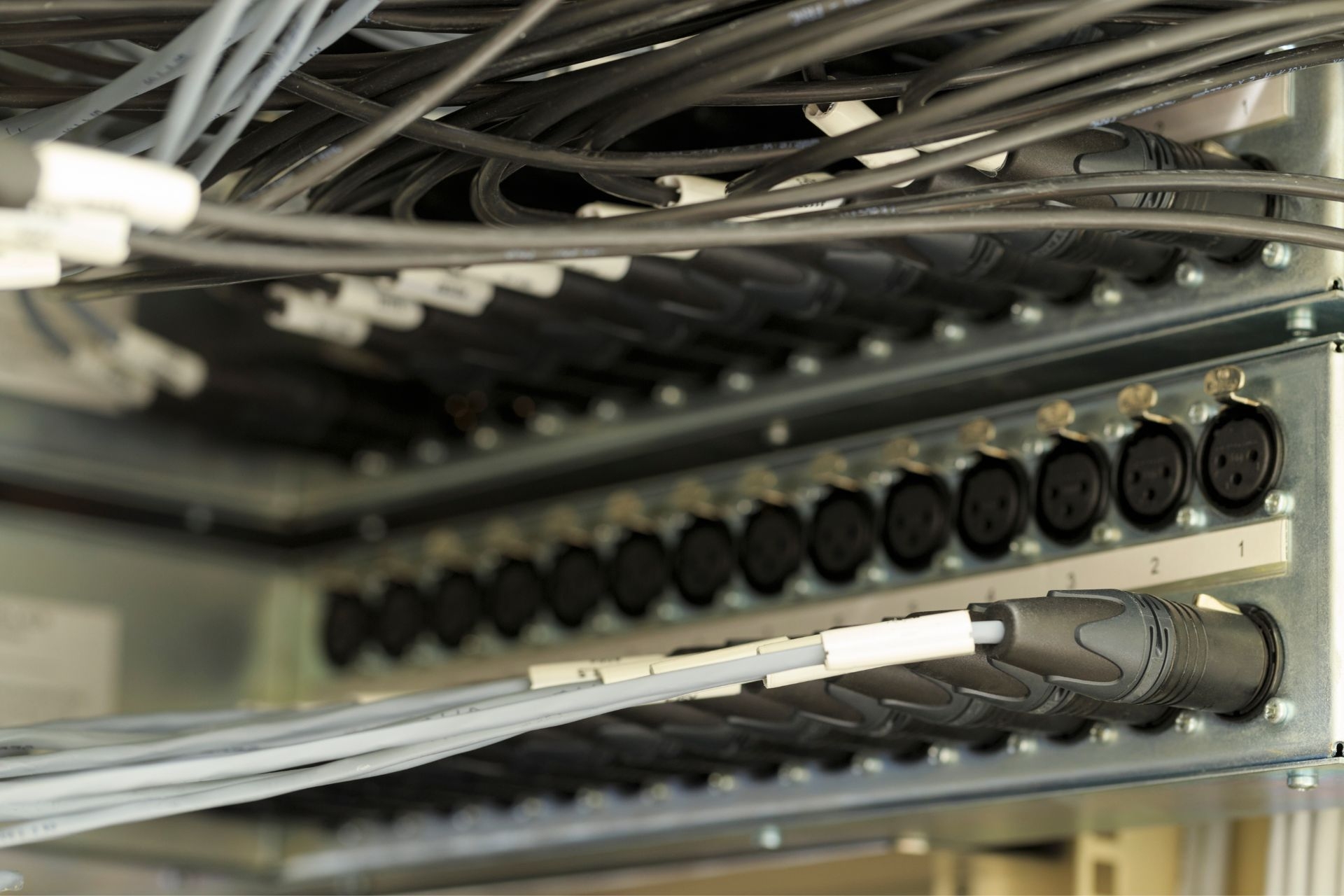 How do patch panels contribute to improving network performance and reducing downtime in a data center?