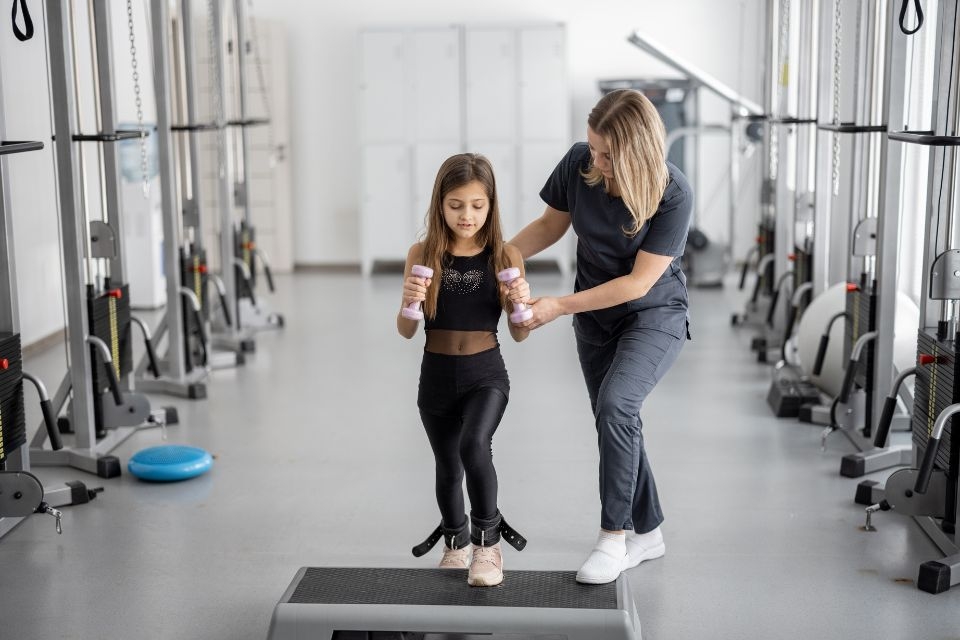 How can I find a qualified instructor or studio for aerial yoga classes?