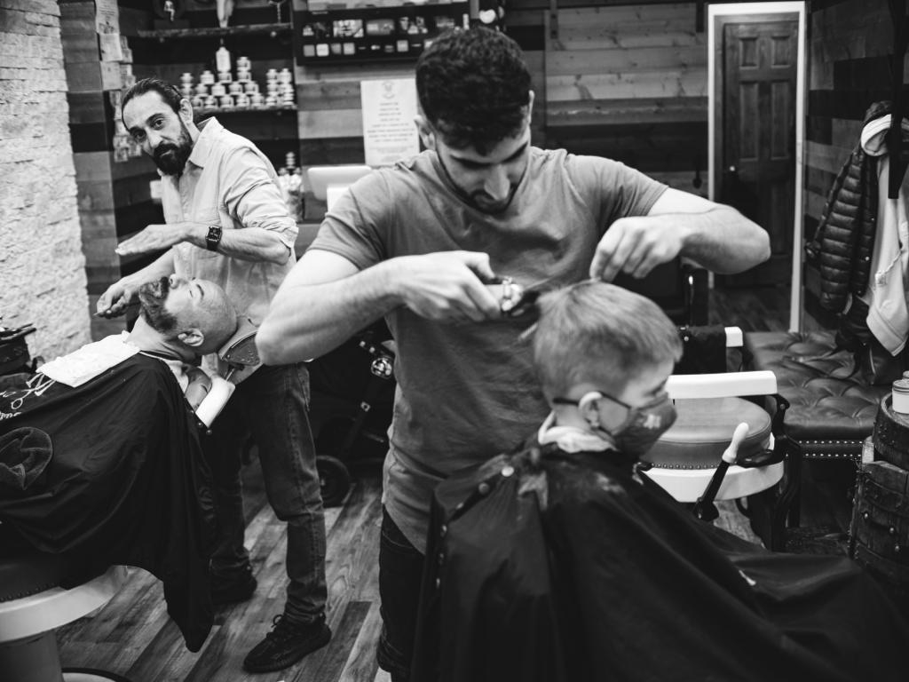 What are some common beard grooming services offered at barber shops?