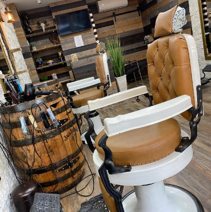 What are some common relaxation services offered at barbershops, such as hot towel treatments or scalp massages?