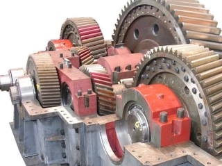 How do external factors such as temperature and pressure impact the structural integrity of the gearbox housing?