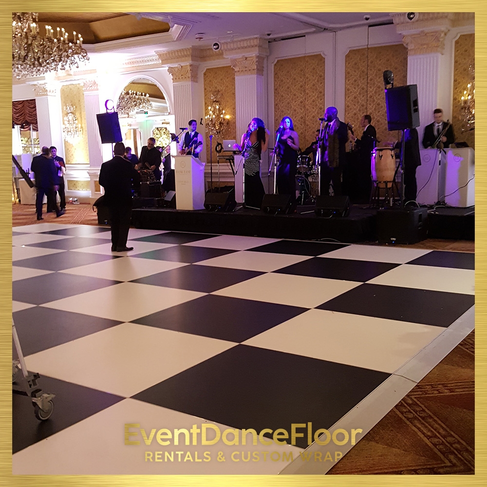 How can lighting be incorporated to complement a custom dance floor vinyl wrap at an event?