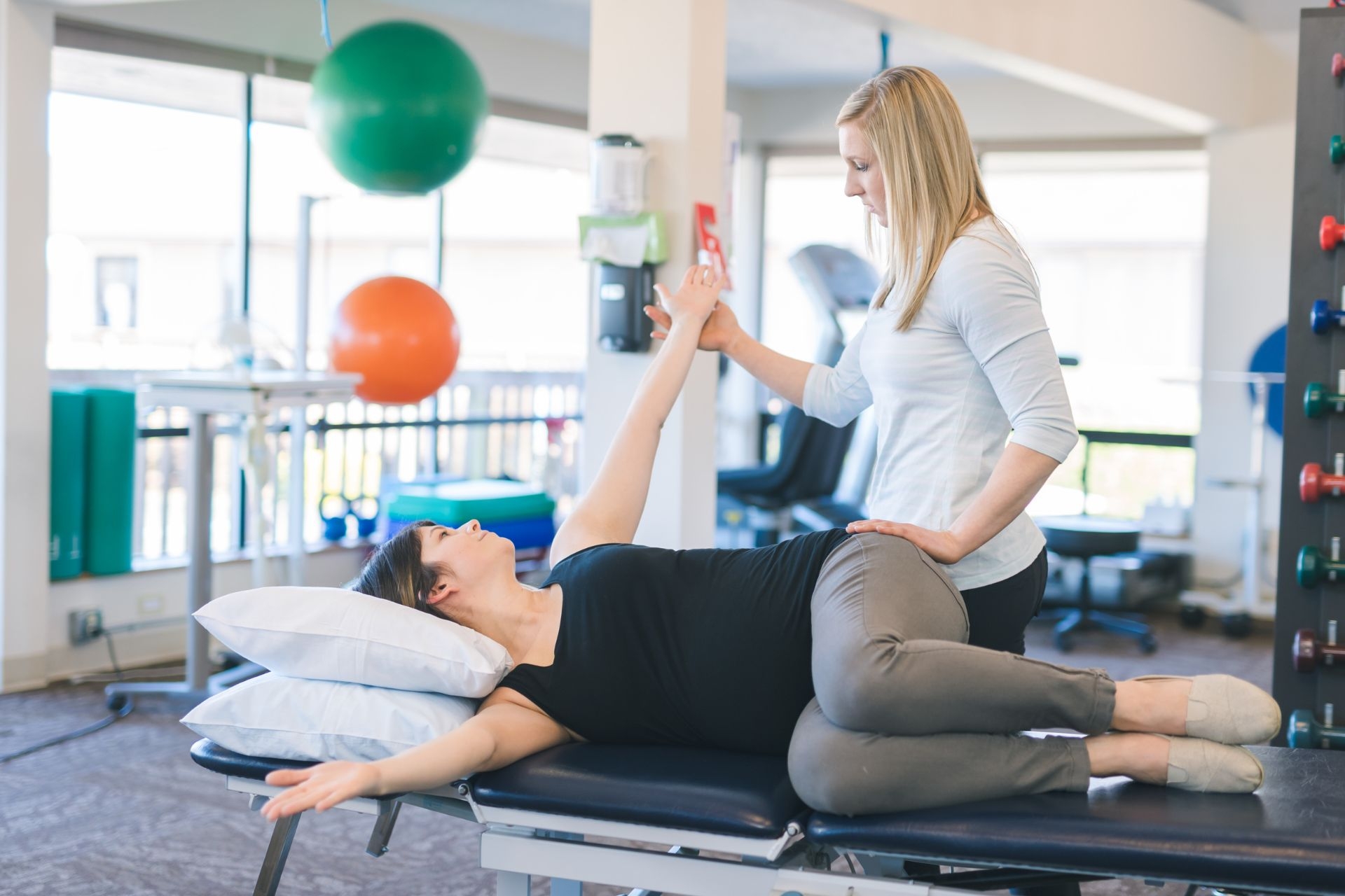 How do you differentiate between weakness in the neck flexor muscles versus weakness in other surrounding muscles during testing?